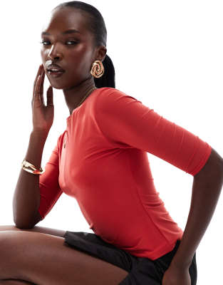 exclusive double layered slinky 3/4 sleeve top in red