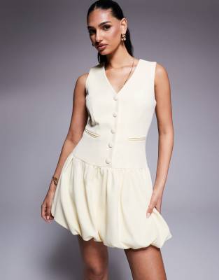 Kaiia Exklusiv - Elegantes ärmelloses Minikleid in Buttermilchgelb mit Knopfleiste und Ballonsaum