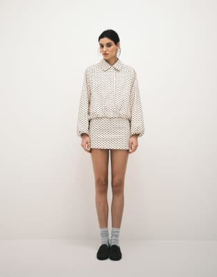 Kaiia - Exklusiver Volant-Minirock aus Funktionsmaterial in Creme mit schwarzen Polka Dots, Kombiteil-Bunt