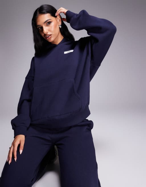 Kaiia - Felpa oversize blu scuro con cappuccio e logo in coordinato