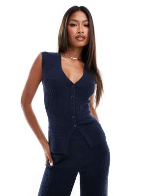 fine cable knit sleeveless button up vest in navy - part of a set