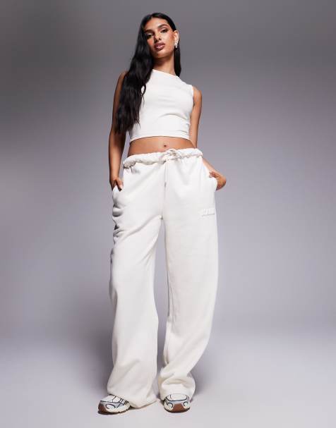 Kaiia - Joggers a fondo ampio in misto cotone color latte d'avena con fascia in vita arrotolata e logo bombato ricamato in coordinato - view 1