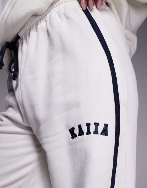 Kaiia - Joggers a fondo ampio in misto cotone crema e blu navy con logo ricamato e riga laterale in coordinato, 5 di 5