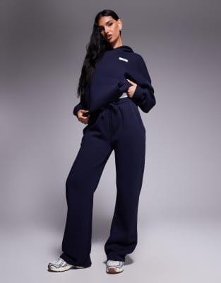 Kaiia - Jogginghose in Marineblau mit hohem Baumwollanteil, farblich abgesetztem Logo-Bund und weitem Bein, Kombiteil