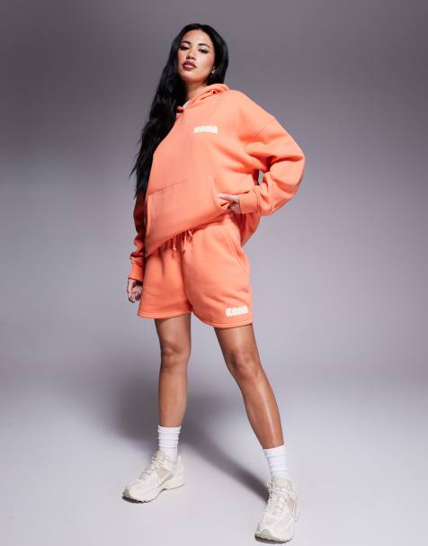 Kaiia – Orange sweatshorts i bomullsmix med gul, puffad logga, del av set - view 1