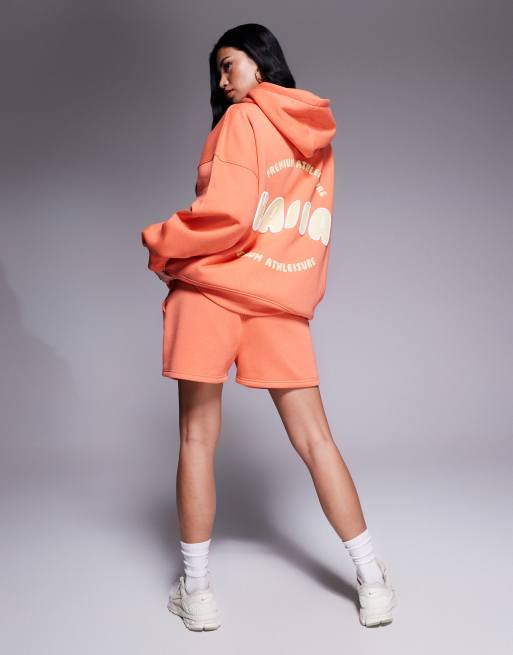 Kaiia – Orange sweatshorts i bomullsmix med gul, puffad logga, del av set  , 2 av 5