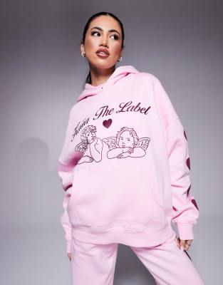 Kaiia - Oversize-Kapuzenpullover in Rosa und Burgunderrot mit Engel-Logo und gepufften Herzverzierungen an den Ärmeln, K...