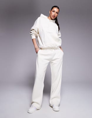 Pantalon de jogging d'ensemble en coton majoritaire avec inscription logo en relief - Babeurre-Blanc 46