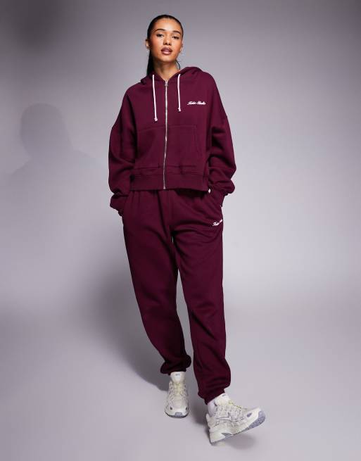 Kaiia - Pantalon de jogging d'ensemble resserré aux chevilles avec logo brodé - Bordeaux et rose
