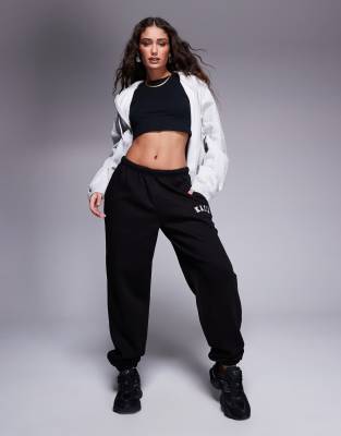 Kaiia Petite cotton blend embroidered logo cuffed sweatpants in black