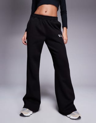 Kaiia Petite embroidered logo wide leg sweatpants in black