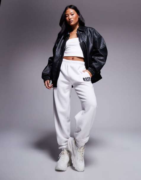 Kaiia - Petite - Studio - Joggingbroek van katoenmix met golvend logo en aansluitende boorden in crème en zwart - view 1