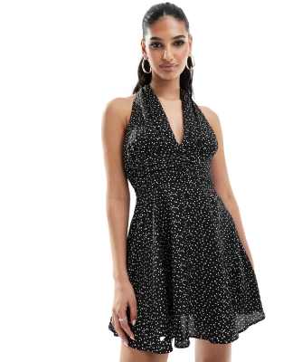 plunge halterneck polka dot mini dress in black and white