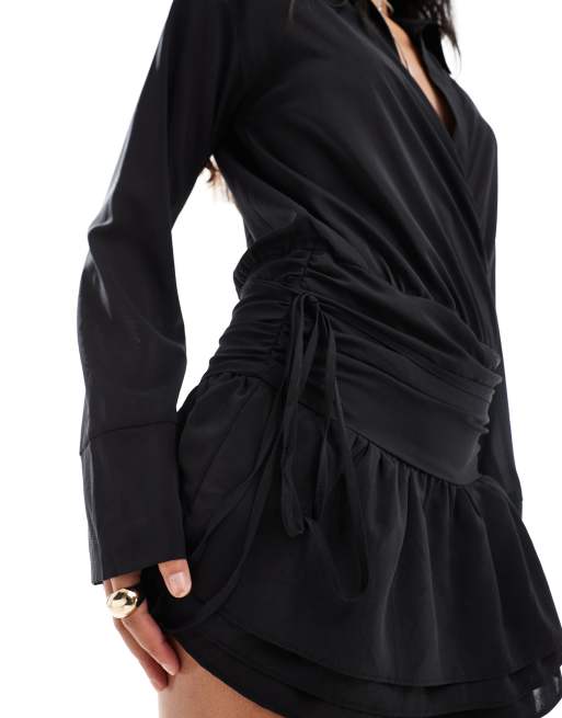 Kaiia plunge neck dropped waist ruffle hem mini dress in black