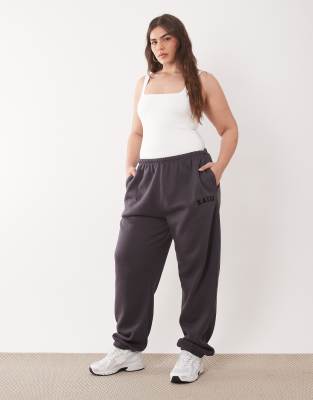 Kaiia Kaiia Plus cotton blend embroidered logo cuffed joggers co-ord in dark grey