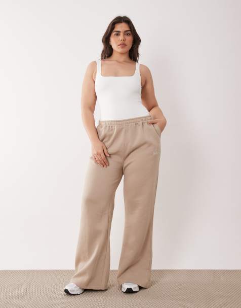 Kaiia Plus - Joggingbroek van katoenmix met wijde pijpen in beige - view 1