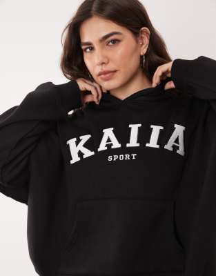 Kaiia Plus - Sweat à capuche d'ensemble oversize sport en coton mélangé avec logo brodé - Noir
