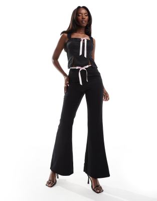 ribbon bow front flared pants in black - part of a set