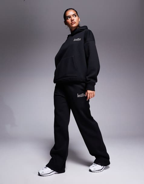 Kaiia – Set in Schwarz und Rosa, aus Oversize-Kapuzenpullover mit Rücken-Logo und weit geschnittener Jogginghose - view 1