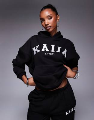 Kaiia Sport - Felpa oversize color nero e crema con cappuccio e logo ricamato in coordinato - view 1