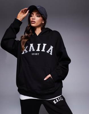 Kaiia Sport - Oversize-Kapuzenpullover in Schwarz und Cremeweiß mit Logo-Stickerei, Kombiteil