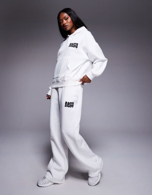 Kaiia Studio - Coordinato color crema e nero con felpa oversize con cappuccio e stampa in rilievo sulla schiena e joggers ampi
