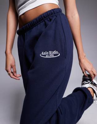 Kaiia Studio Embroidered Logo Cuffed Sweatpants In Navy