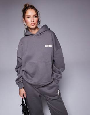 Kaiia Studio - Oversize-Kapuzenpullover in Dunkelgrau und Gelb mit Bubble-Logo auf dem Rücken, Kombiteil