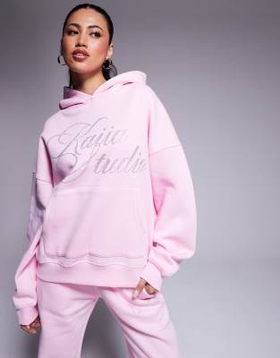 Kaiia - Studio - Oversize-Kapuzenpullover in Rosa mit Strass-Logo, Kombiteil