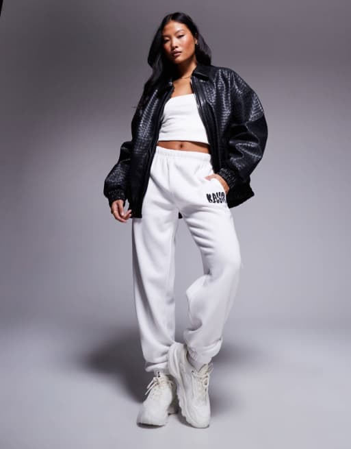 Kaiia Studio Petite cuffed wavy logo trackies in cream and black