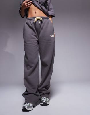 Studio wide leg sweatpants in dark gray and yellow - part of a set