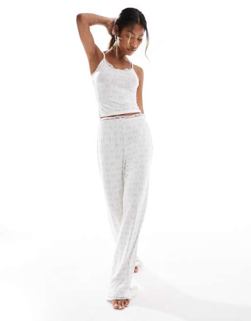 Kaiia wide leg pyjama bottoms co-ord in cream and blue bow print with lace trim, 4 of 4