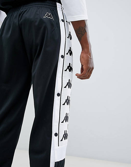 Kappa – Schwarze Jogginghose mit Druckknöpfen am Saum und breitem Logoband  | ASOS