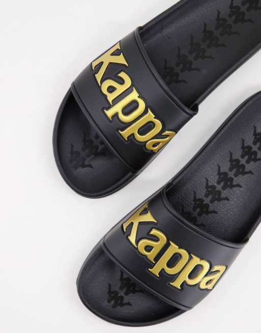 Kappa – Svart och guldfärgade tofflor med logga