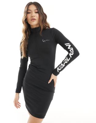 Karl Kani - Bodycon-Kleid in Schwarz mit langen Ärmeln, Schriftzug-Print und kurzem Reißverschluss