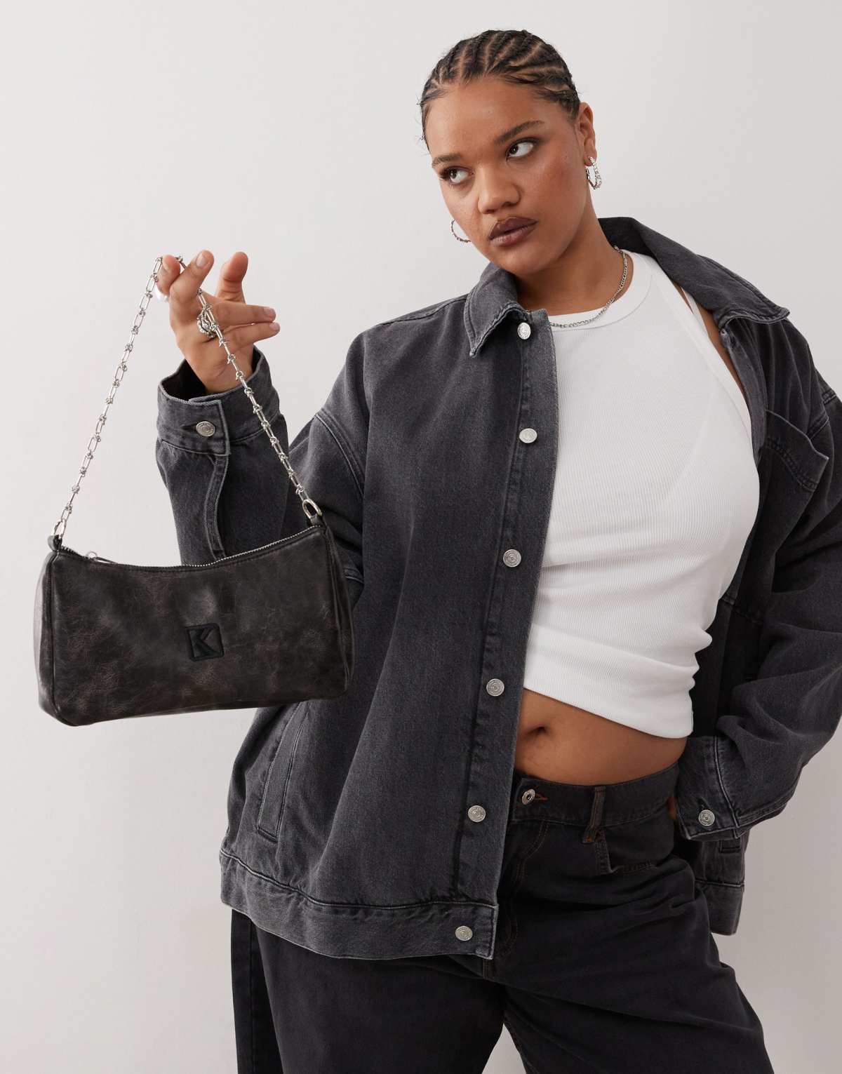 Karl Kani crackle faux leather knot shoulder bag in black