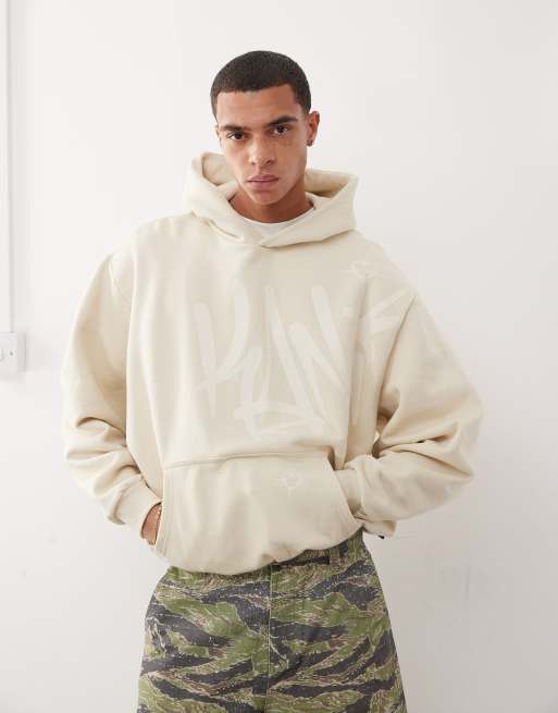 Karl Kani – Kapuzenpullover in Beige mit Signatur-Tag-Grafiklogo