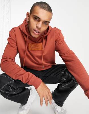 Karl Kani – Kapuzenpullover in verwaschenem Orange mit kleiner Signatur-Logobox
