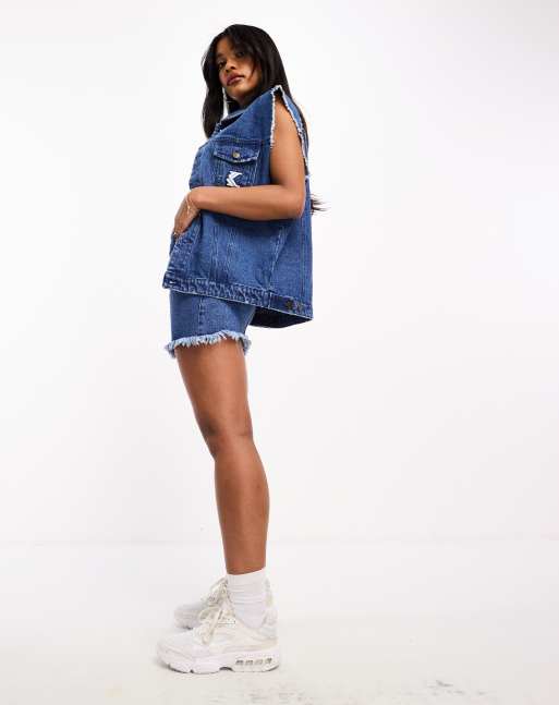Karl Kani - Mouwloos denim jack met logo in blauw