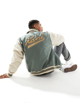 Karl Kani OG varsity bomber jacket in dusty green with faux leather sleeves and multi logo embroidery