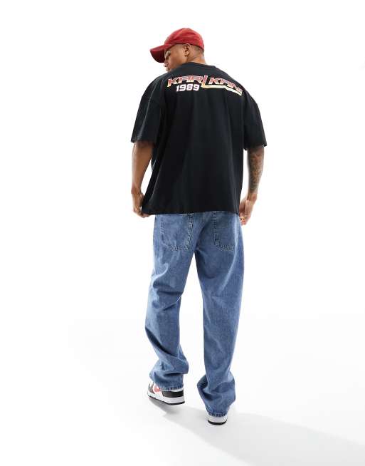 Karl Kani - Oversized T-shirt med signaturlogo og reflekterende motosport-print på ryggen i salviegrøn