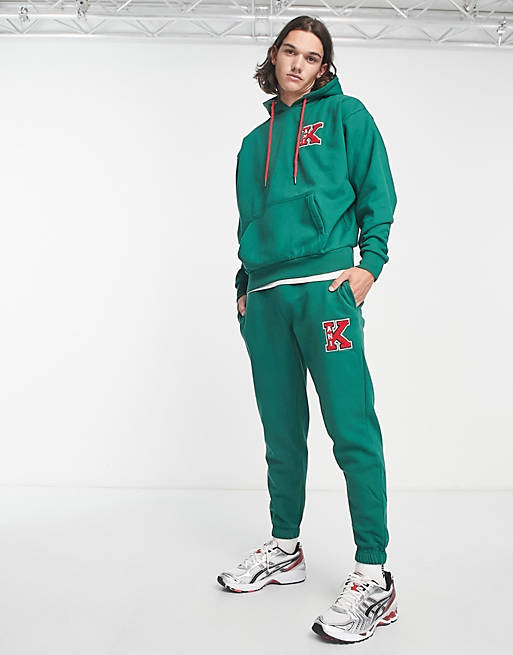 Karl Kani retro patch trackies in green