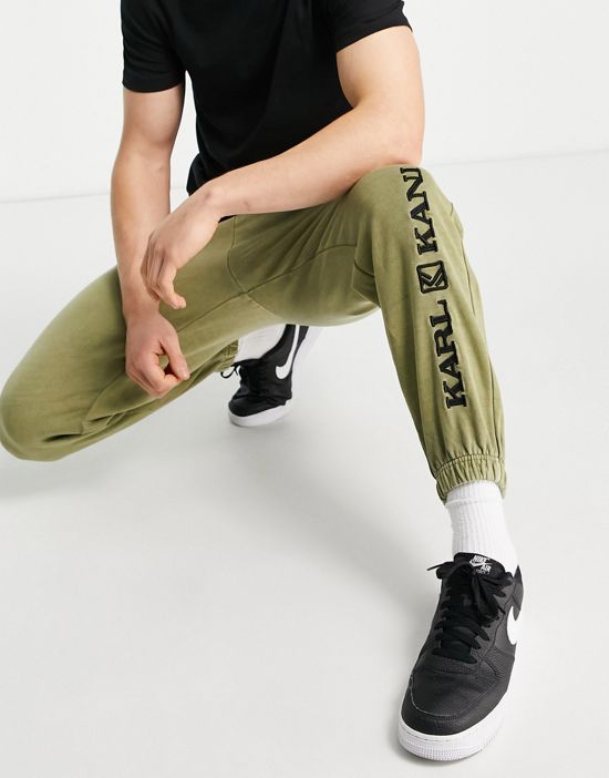 https://images.asos-media.com/products/karl-kani-retro-washed-sweatpants-in-green/201049917-4?$n_550w$&wid=550&fit=constrain