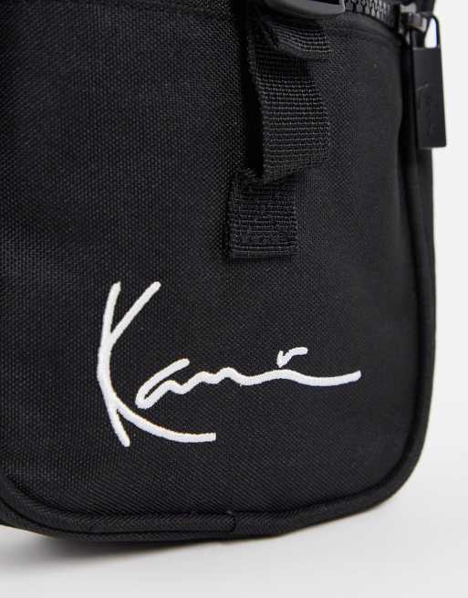 Karl Kani signature tape messenger bag in black | ASOS