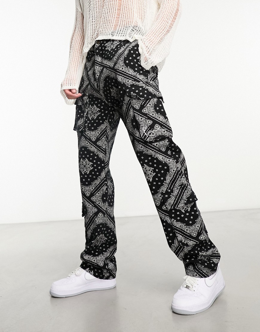Karl Kani small signature cargo trousers in black with all over paisley print