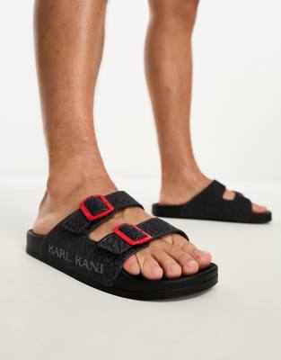 Karl Kani street sliders in black with red buckles