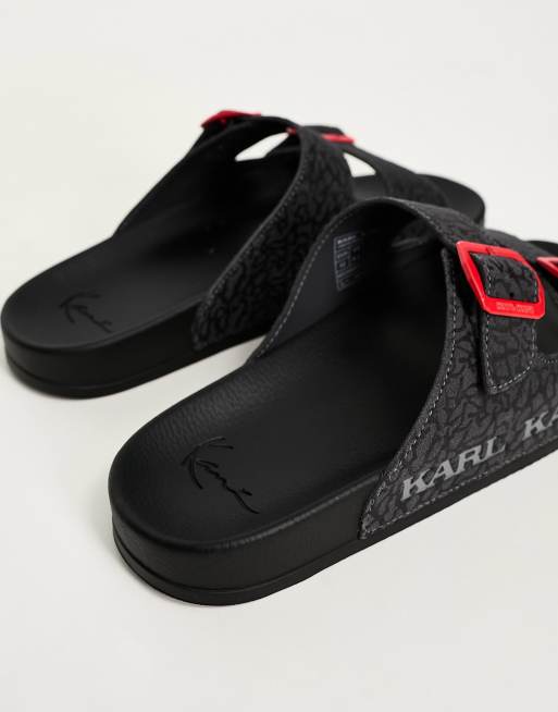 Karl Kani street sliders in black with red buckles | ASOS