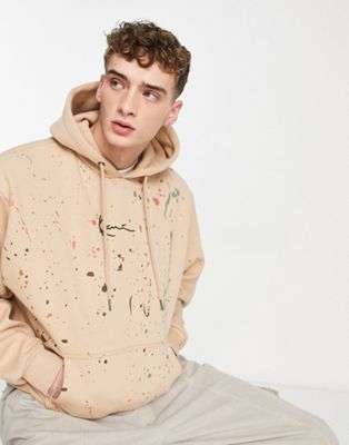 Karl Kani paint splatter hoodie in beige  - ASOS Price Checker