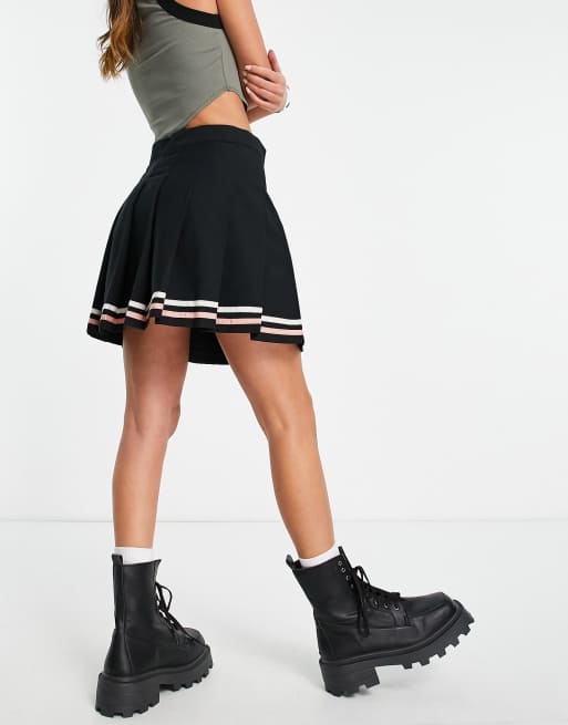 Black tennis skirt with white outlet stripe