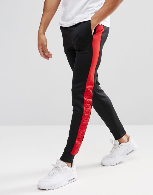 Black joggers with red and cheap white stripe